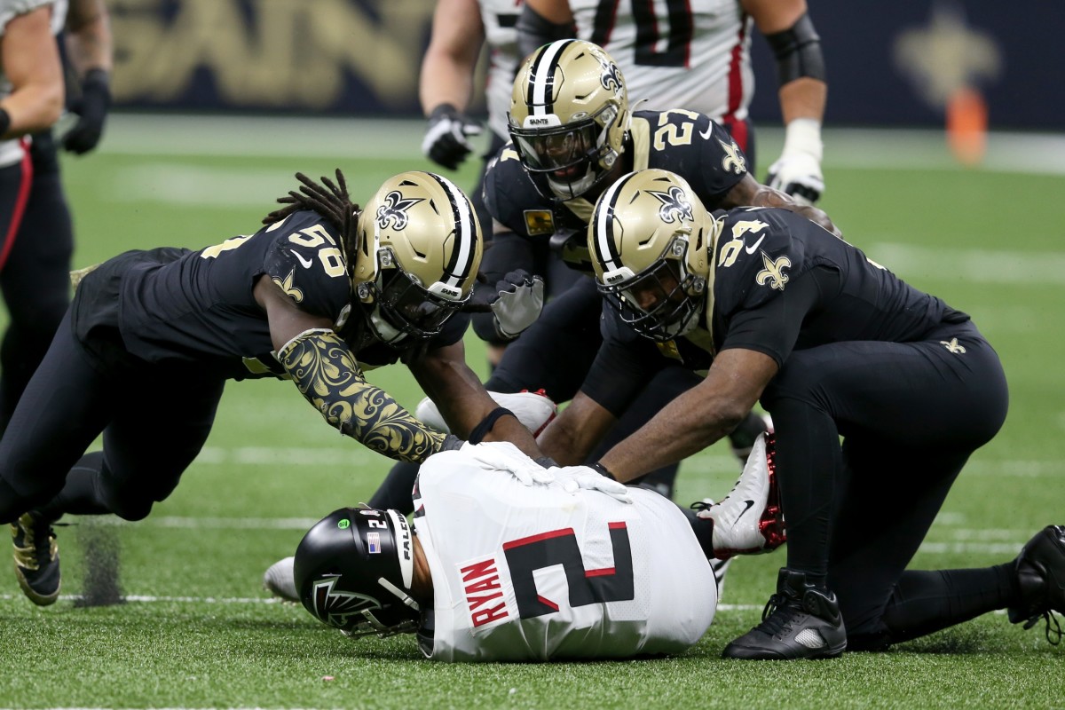 Nov 7, 2021; Atlanta Falcons quarterback Matt Ryan (2) is sacked by linebacker Demario Davis (56) and defensive end Cameron Jordan (94). Mandatory Credit: Chuck Cook-USA TODAY Sports